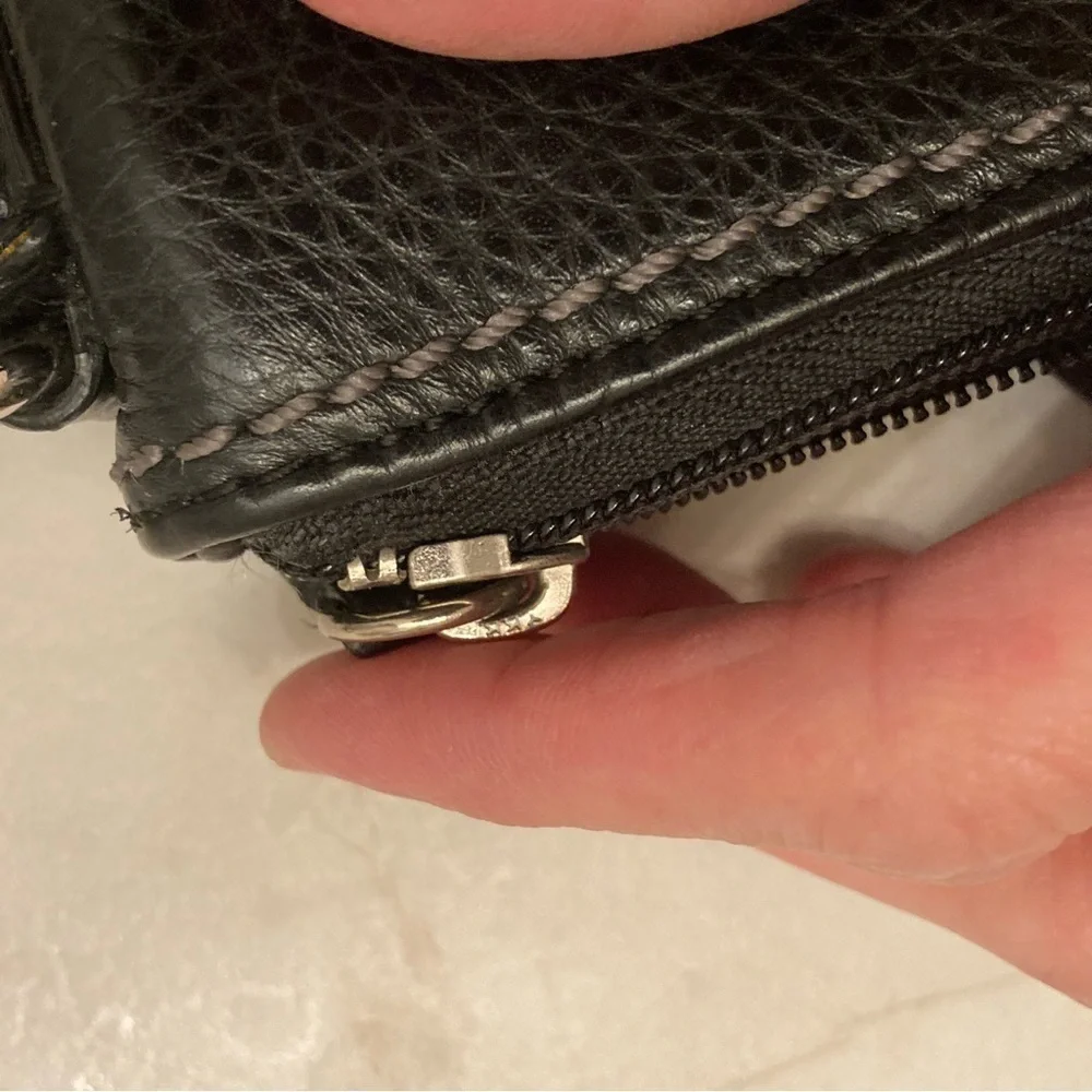 Coach black pebbled leather turnlock swingpack crossbody bag